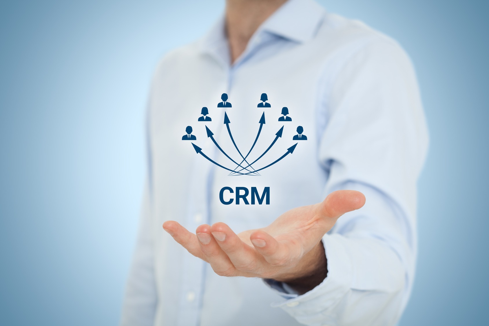 Customer relationship management (CRM) concept. Businessman hold virtual scheme representing CRM.